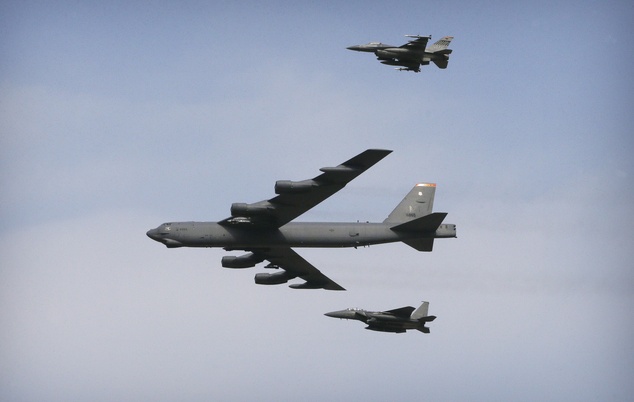 A U.S. Air Force B-52 bomber flies over Osan Air Base in Pyeongtaek South Korea Sunday Jan. 10 2016. The powerful U.S. B-52 bomber flew low over South Ko