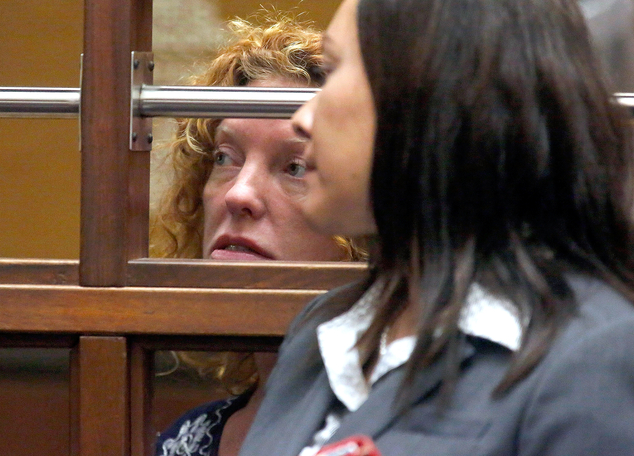 ADDS IDENTITY OF WOMAN IN FOREGROUND- Tonya Couch left attends an extradition hearing as one of her attorneys Sonia Perez-Chaisson is seen in the foreg