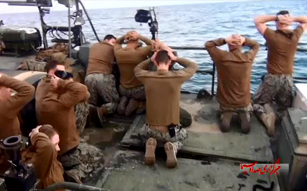 U.S. sailors on their knees after their capture by IRGC speedboats earlier this month