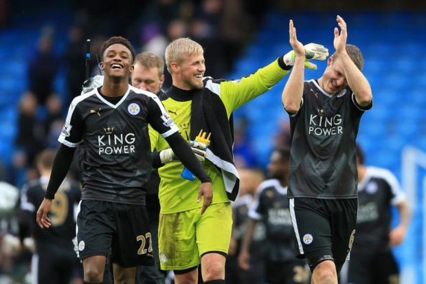 Leicester Citys Robert Huth right goalkeeper Kasper Schmeichel and Demarai Gray applaud supporters after their 3-1 win over Manchester City. Inset Claudio Ranieri